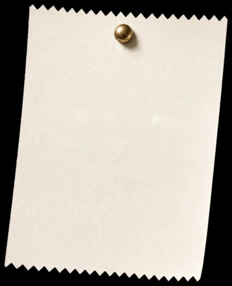 Pinked-edge paper label pinned to the wall with a brass pin