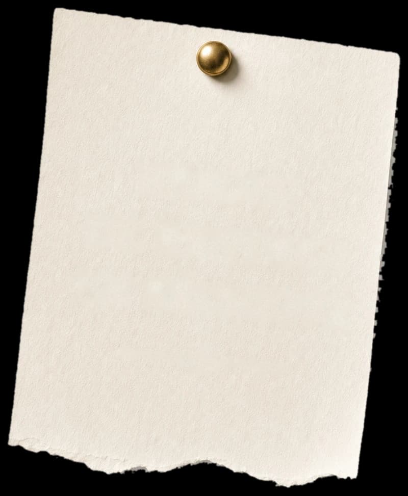 Torn paper label pinned to the wall with a brass pin